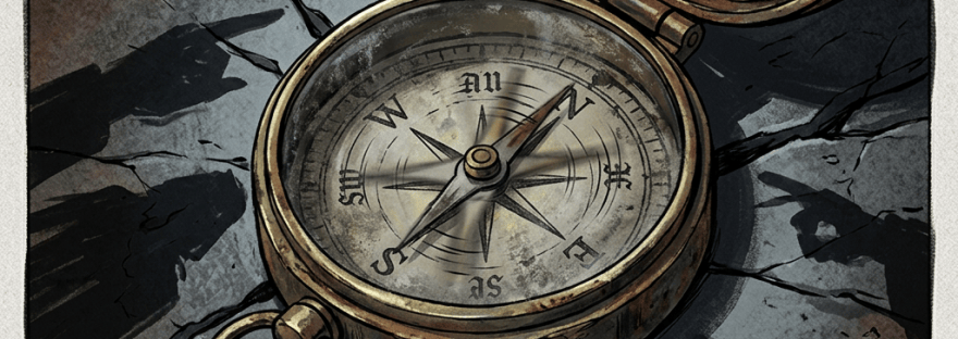 Open brass compass lying on cracked stone